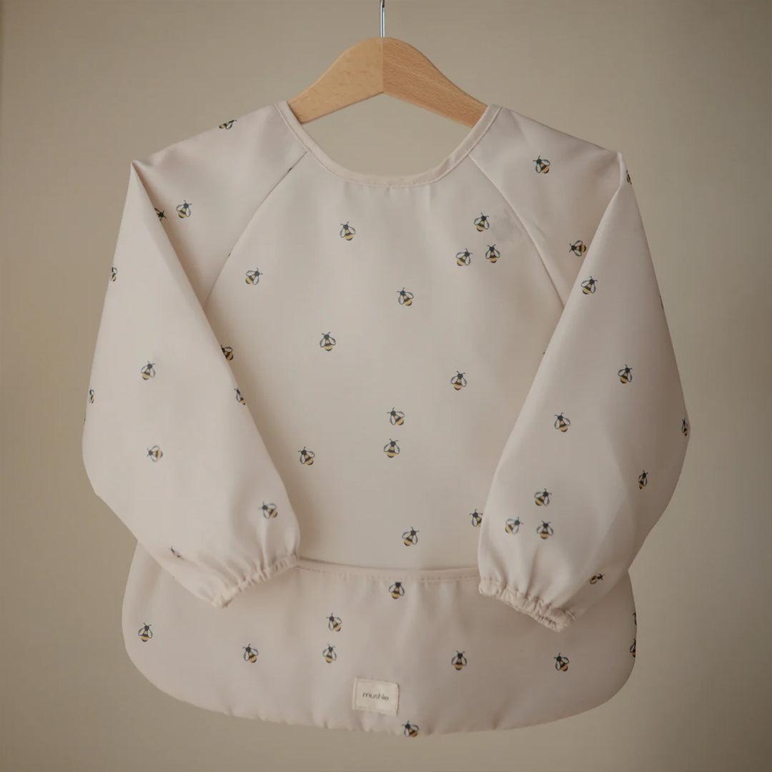 Mushie Long Sleeve Bib - Cream Bees-Bibs-Cream Bees- | Natural Baby Shower